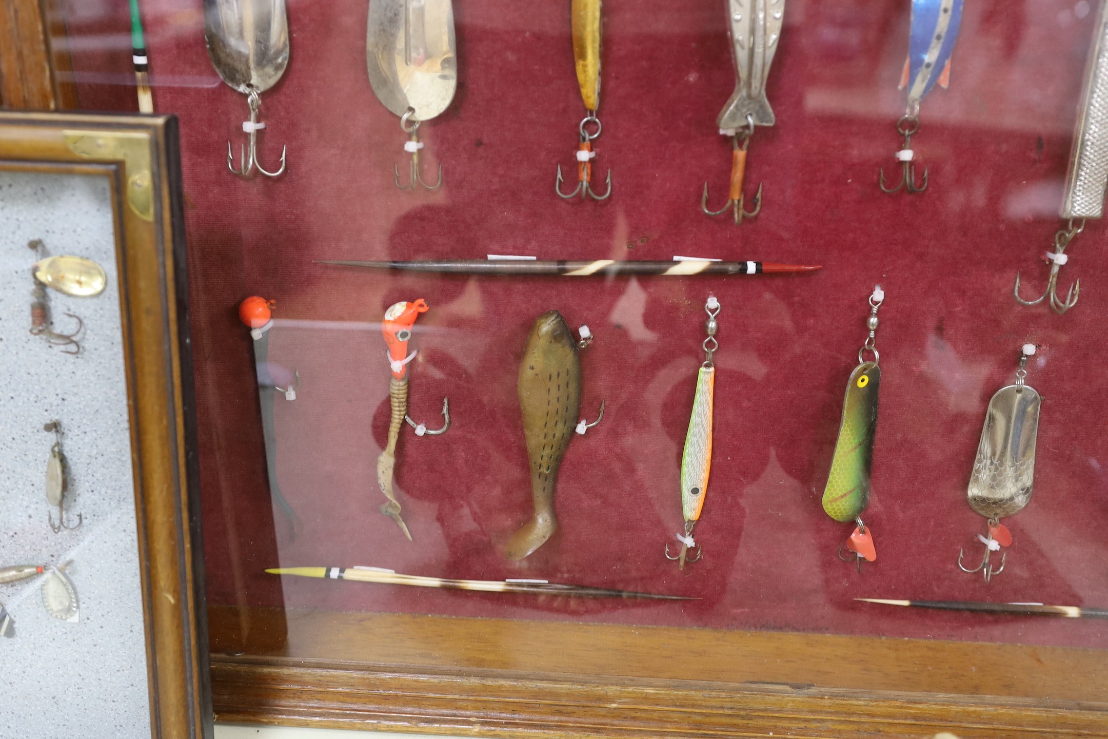 Two cased sets of fishing lures